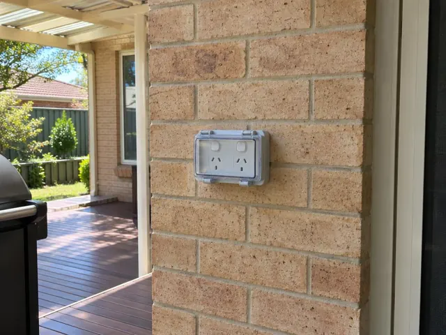 Outdoor double power point on a brick wall beside a patio in Fassifern